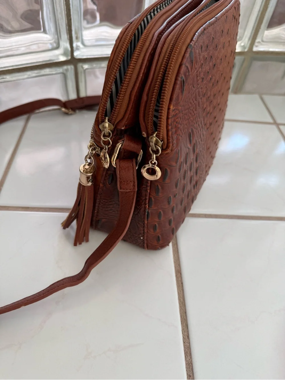 Women's Brown Crossbody Bag with Crock Print & Tassel Zip Pocket